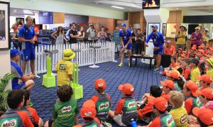 Players take part in a kiwifruit tossing competition. Photograph — Robyn Molloy. 