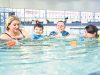 Kelly Sanders and son Jeremy benefit from swim teachers Martina McGovern and Chloe Were-Spice, who have received state recognition for their teaching. Photograph — Matt Devlin.