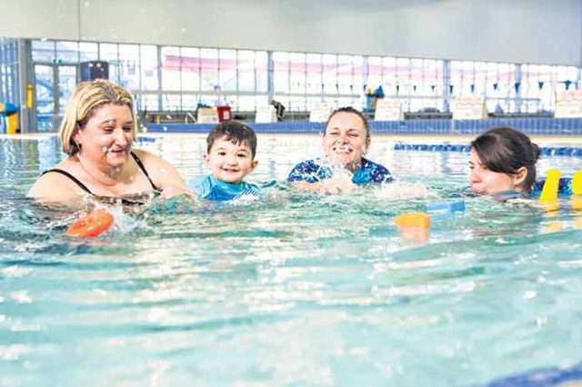 Kelly Sanders and son Jeremy benefit from swim teachers Martina McGovern and Chloe Were-Spice, who have received state recognition for their teaching. Photograph — Matt Devlin.