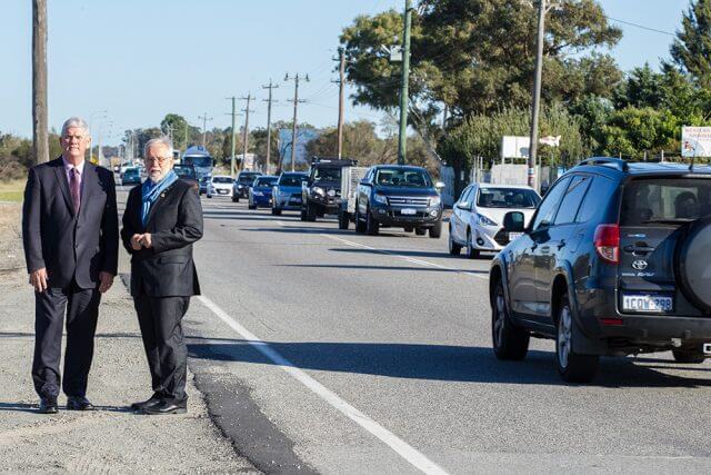 Cockburn mayor Logan Howlett and Armadale mayor Henry Zelones at the Nicholson Road intersection with traffic banking up 800 metres either side of Armadale Road. Photograph — Matt Devlin.