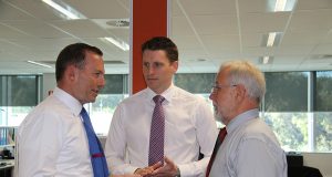 Prime Minster Tony Abbott, Canning Liberal candidate Andrew Hastie and City of Armadale mayor Henry Zelones discuss CCTV.