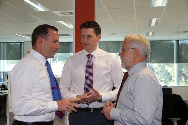 Prime Minster Tony Abbott, Canning Liberal candidate Andrew Hastie and City of Armadale mayor Henry Zelones discuss CCTV.