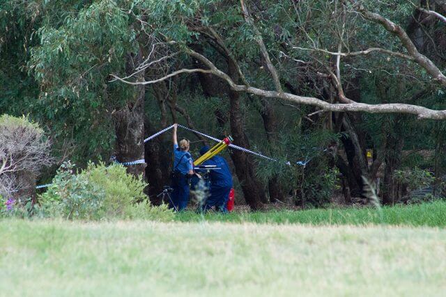 Police at the scene of the murder in April 2013. Photograph — Matt Devlin.