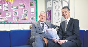 Westfield Park primary school principal Steve Soames reading the full service schools plan with Member for Armadale Tony Buti. Photograph — Matt Devlin.