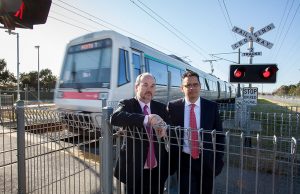 Member for Cannington Bill Johnston and shadow treasurer Ben Wyatt at the Wharf Street level crossing on Monday. Photograph — Matt Devlin.