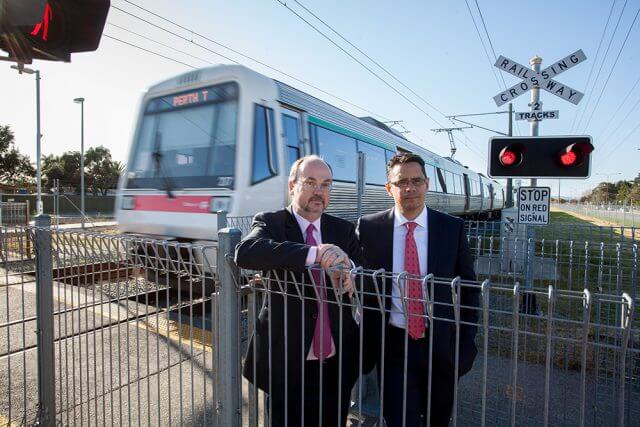 Member for Cannington Bill Johnston and shadow treasurer Ben Wyatt at the Wharf Street level crossing on Monday. Photograph — Matt Devlin.