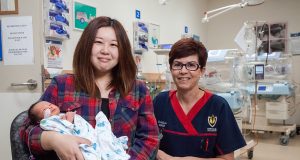 Hitomi Ogaya with 10-day old son Leon Ng and clinical nurse Leanne Howell. Leon was born five weeks early, weighing in at 2050 grams and was 40 grams heavier 10 days later. Photograph — Matt Devlin.
