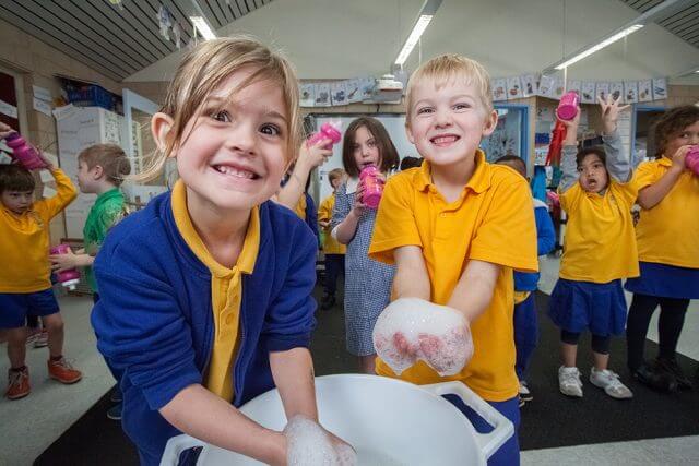 Jasie Allen and Isaac Keep learned the importance of washing their hand to halt the spread of meningococcal. Photograph — Matt Devlin.