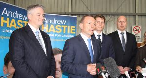Finance minister Mathias Cormann, Prime Minister Tony Abbott, Canning by-election candidate Andrew Hastie and WA Transport Minister Dean Nalder at a joint announcement to fund the Armadale road duplication at Beaver Tree Services warehouse in Kelmscott on Saturday. Photograph - Robyn Molloy.