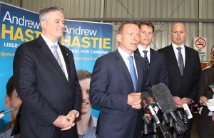 Finance minister Mathias Cormann, Prime Minister Tony Abbott, Canning by-election candidate Andrew Hastie and WA Transport Minister Dean Nalder at a joint announcement to fund the Armadale road duplication at Beaver Tree Services warehouse in Kelmscott on Saturday. Photograph - Robyn Molloy.