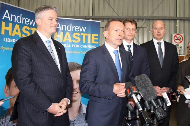 Finance minister Mathias Cormann, Prime Minister Tony Abbott, Canning by-election candidate Andrew Hastie and WA Transport Minister Dean Nalder at a joint announcement to fund the Armadale road duplication at Beaver Tree Services warehouse in Kelmscott on Saturday. Photograph - Robyn Molloy.