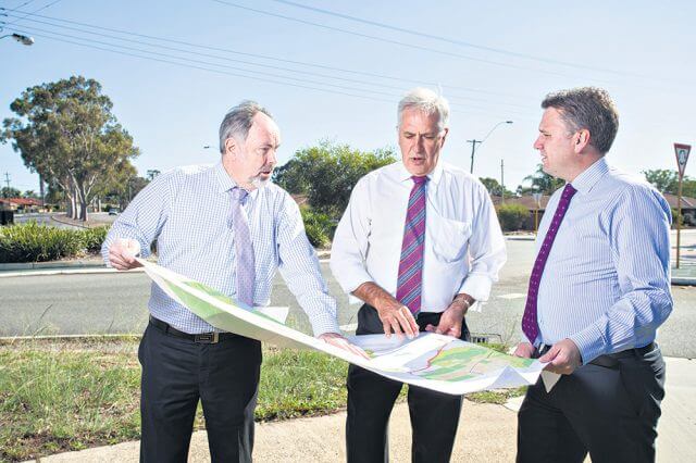 Armadale chief executive Ray Tame, Member for Canning Don Randall and assistant minister for infrastructure and regional development Jamie Briggs discussing the $1.5 million of black spot projects announced for the City of Armadale. Photograph — Matt Devlin.