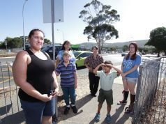 Camillo residents Laura Shockthorap, Wendy Muilenburg, Barbara Whitnell with Scott Muilenburg, Patrick Shockthorap and Krystal Pinnell at the intersection. Photograph — Matt Devlin.