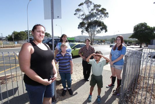 Camillo residents Laura Shockthorap, Wendy Muilenburg, Barbara Whitnell with Scott Muilenburg, Patrick Shockthorap and Krystal Pinnell at the intersection. Photograph — Matt Devlin.