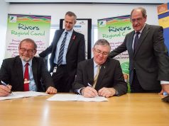 Local Government Minister Tony Simpson and Rivers Regional council chief executive Alex Sheridan witness City of Gosnells mayor Dave Griffiths and Rivers Regional council chairman Ron Hoffman signing the contracts for the alternative waste treatment facility. Photograph — Matt Devlin.