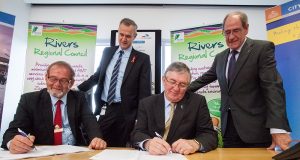 Local Government Minister Tony Simpson and Rivers Regional council chief executive Alex Sheridan witness City of Gosnells mayor Dave Griffiths and Rivers Regional council chairman Ron Hoffman signing the contracts for the alternative waste treatment facility. Photograph — Matt Devlin.