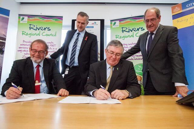 Local Government Minister Tony Simpson and Rivers Regional council chief executive Alex Sheridan witness City of Gosnells mayor Dave Griffiths and Rivers Regional council chairman Ron Hoffman signing the contracts for the alternative waste treatment facility. Photograph — Matt Devlin.