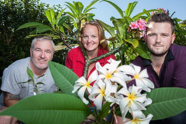 Lee Fitzpatrick, Sue Trapnell and Michael North with the plants that will be for sale at the plant sale on December 5. Photograph — Matt Devlin.