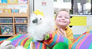 Charlie Lawson plays with animal puppets at the opening of the child and parent centre in Gosnells. Photograph — Matt Devlin.