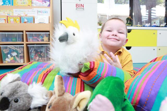 Charlie Lawson plays with animal puppets at the opening of the child and parent centre in Gosnells. Photograph — Matt Devlin.