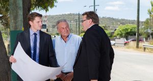 Federal Member for Canning Andrew Hastie, Shire of Serpentine Jarrahdale chief executive Richard Gorbunow and shire president John Erren inspect plans for the duplication of Abernethy Road. Photograph — Matt Devlin.