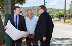 Federal Member for Canning Andrew Hastie, Shire of Serpentine Jarrahdale chief executive Richard Gorbunow and shire president John Erren inspect plans for the duplication of Abernethy Road. Photograph — Matt Devlin.