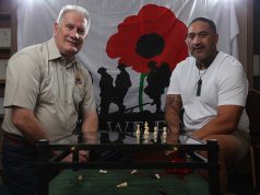 Armadale RSL president Ken Hepburn with Seville Grove artist Gracey and his piece highlighting mental health issues in soldiers. Photograph — Matt Devlin.