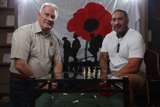 Armadale RSL president Ken Hepburn with Seville Grove artist Gracey and his piece highlighting mental health issues in soldiers. Photograph — Matt Devlin.