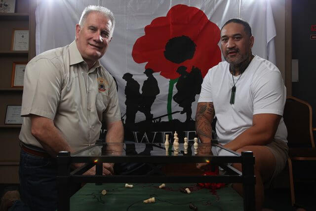 Armadale RSL president Ken Hepburn with Seville Grove artist Gracey and his piece highlighting mental health issues in soldiers. Photograph — Matt Devlin.