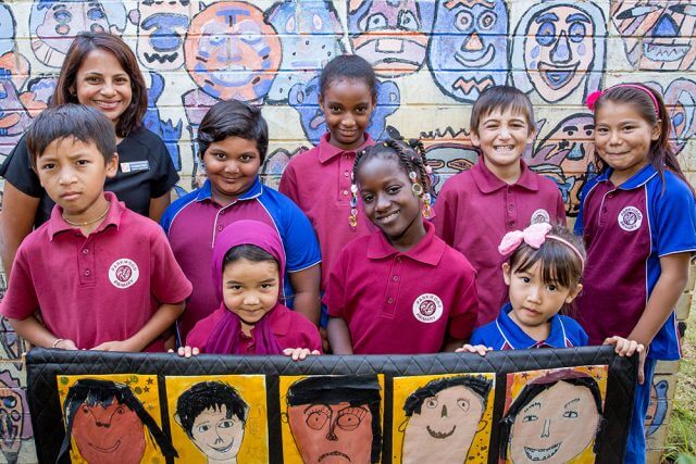 Parkwood Intensive English Centre deputy principal Letchme Paul with students who will be involved in the multicultural festival celebrations. Photograph — Kelly Pilgrim-Byrne.