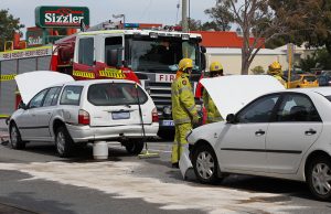 Firefighters cleaning up the fuel leak from the Falcon. Photograph – Matt Devlin.