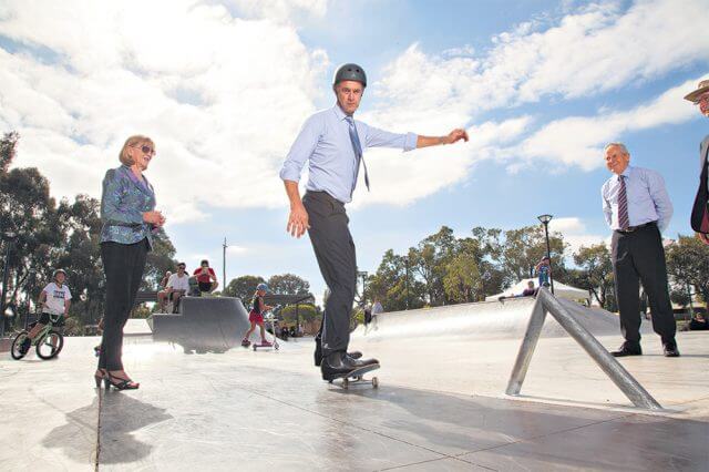 Youth Minister Tony Simpson tries out the skate plaza in Beckenham on Wednesday afternoon while City of Gosnells director of infrastructure Dave Harris watches on in amazement at Mr Simpson’s skills. Photograph — Matt Devlin.