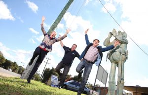 Byford Progress Association president Colleen Rankin, Shire of Serpentine Jarrahdale president John Erren and artist Len Zuks welcome traffic inspector Charlie Knox back to his old post on South Western Highway. Photograph — Matt Devlin.